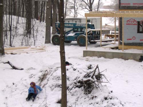 2004_01_24 008 Allison Sledding on the Dirt Pile in the Backyard