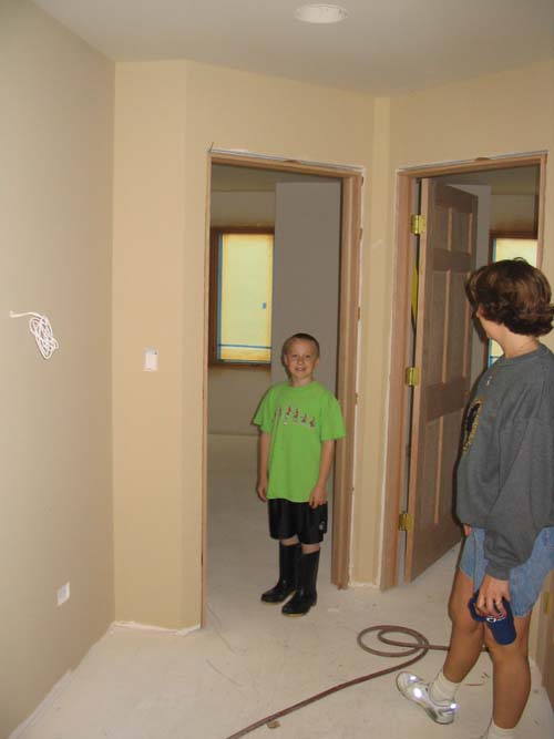 2004_05_22 030 Corte and Wendi Inspecting the Upstairs Hall